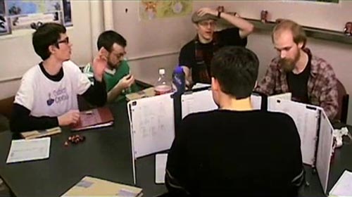 Role-players sitting around a table from the movie The Gamers